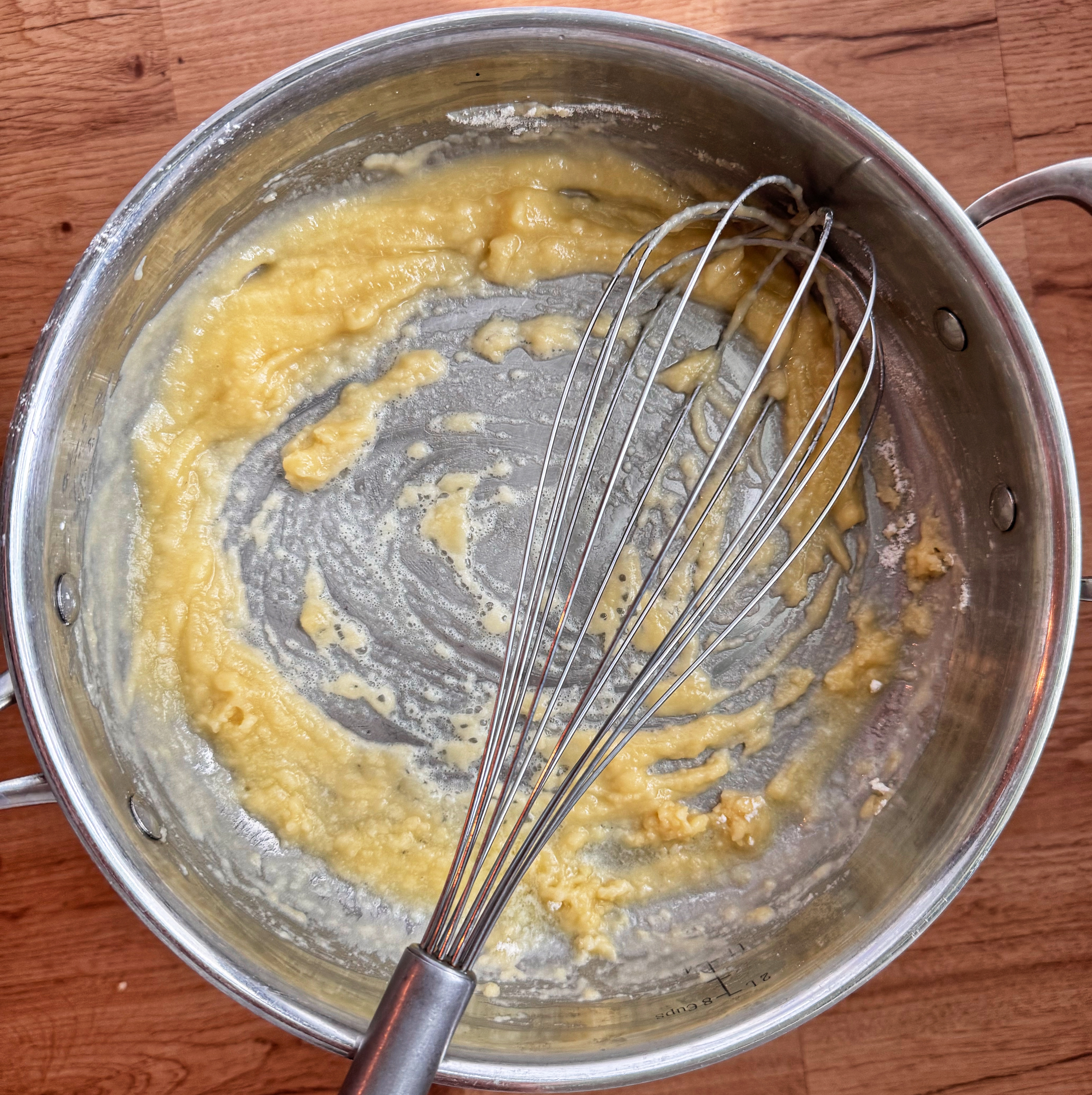 roux in pan with whisk