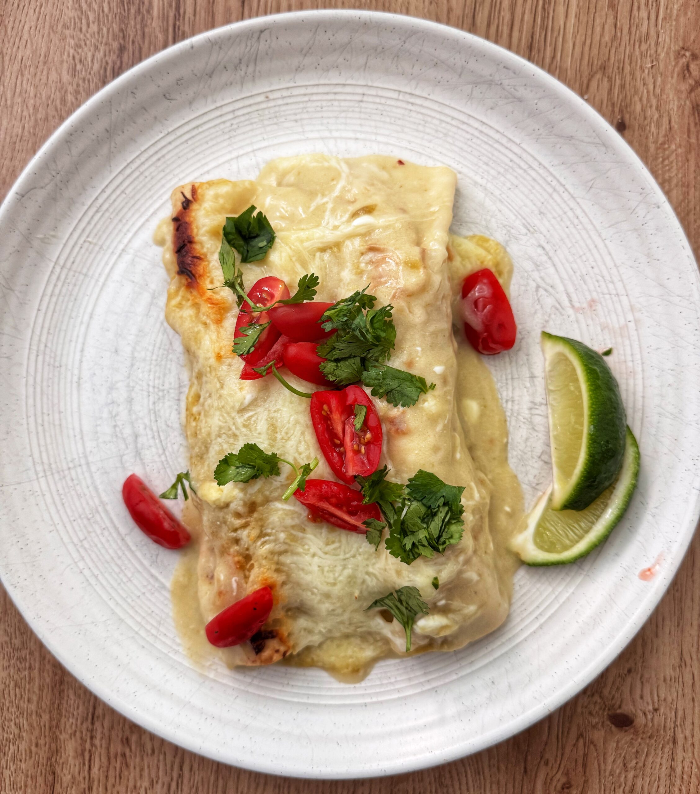 finished chicken enchiladas with toppings